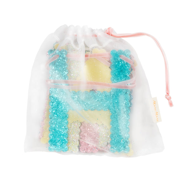 Our glitter garland features the words Happy Birthday in bright colours, with a pink velvet hanging ribbon, packaged in a fabric bag. Image5