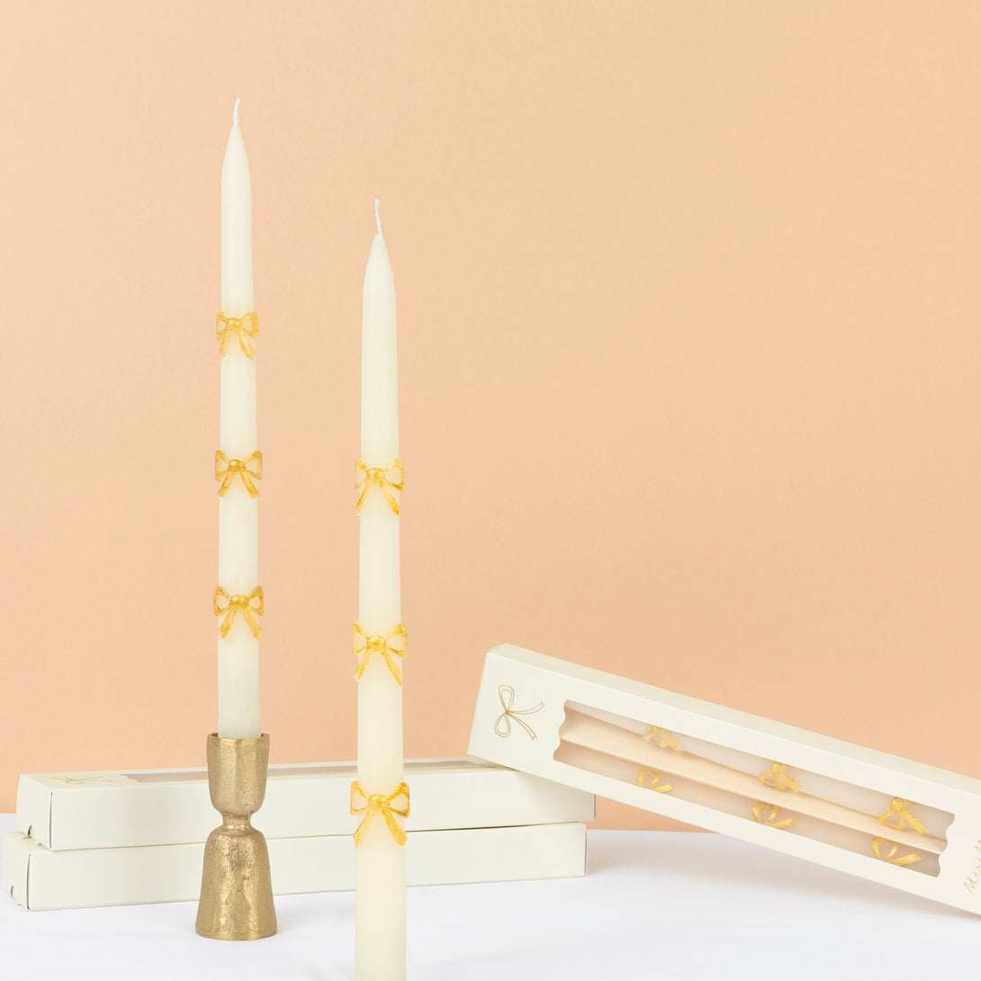 Our taper candles, with a bow design, are perfect as Christmas decorative candles. Image1
