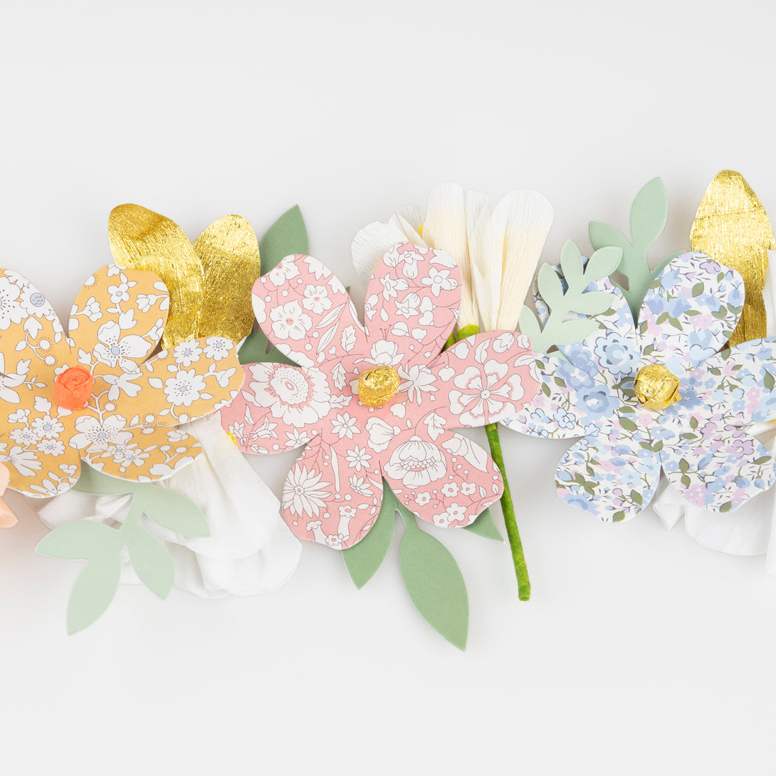 Our floral garland features pretty Liberty prints, making it wonderful for home decoration or as a baby shower decoration.