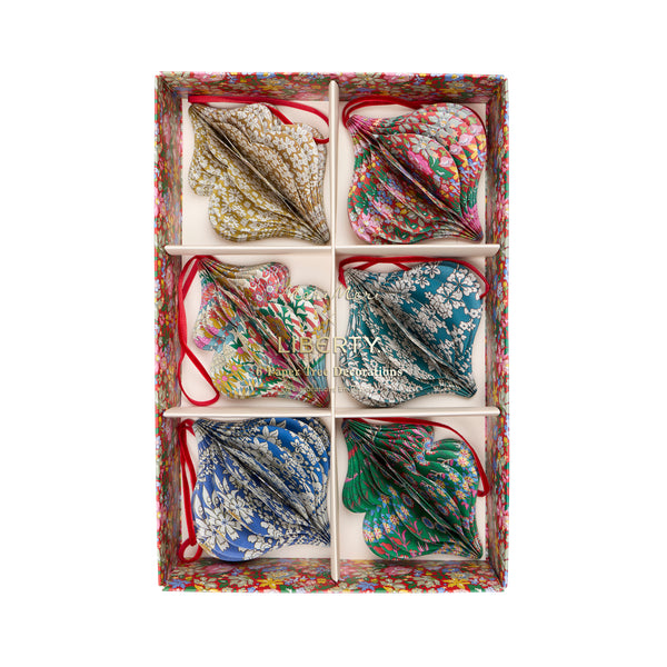 Our Christmas tree decorations, in elegant ornamental shapes, have honeycomb details and beautiful Liberty print designs in festive colours. Image10