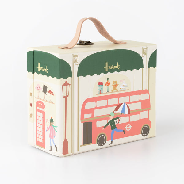 Our iconic Harrods mini suitcase includes an advent calendar where you'll get to create a charm bracelet over 24 days. Image3