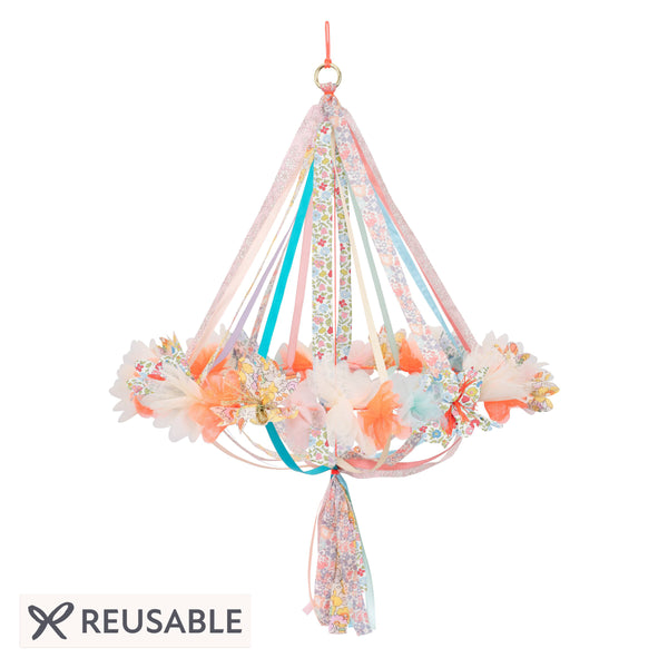 This hanging flower decoration is made from colourful fabric with streamers. Image1