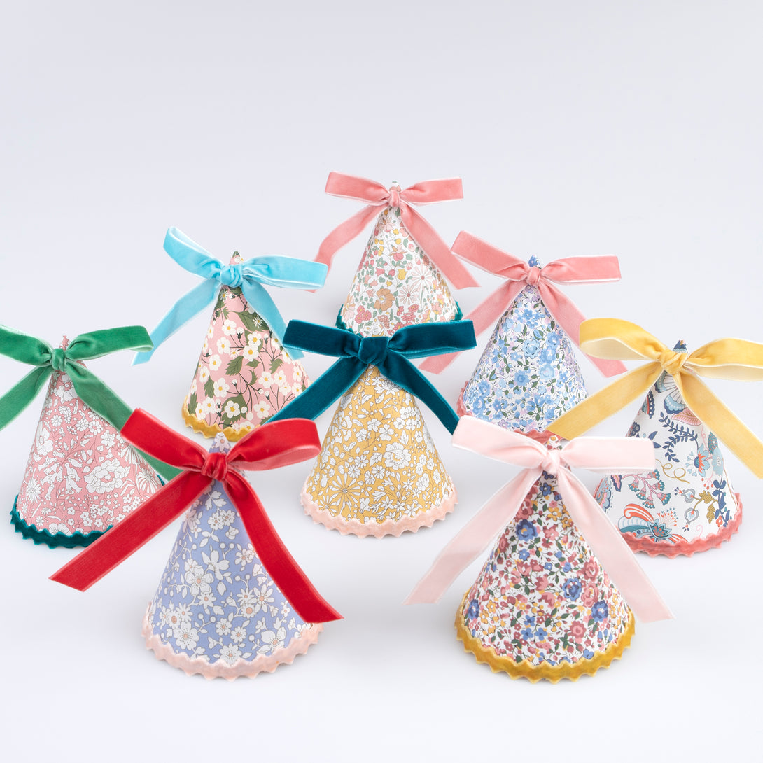 Our sophisticated paper hats, with Liberty floral print designs, velvet bows and velvet ricrac, are great as tea party hats.