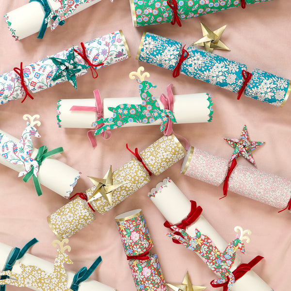 Make your Christmas dinner table look elegant with our luxury Liberty crackers with velvet bows and origami stars, containing wonderful gifts. Image3