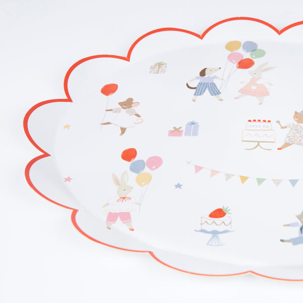 Our childrens plates, crafted from quality paper, feature adorable animals in soft colours with pops of red and shiny gold. Image2