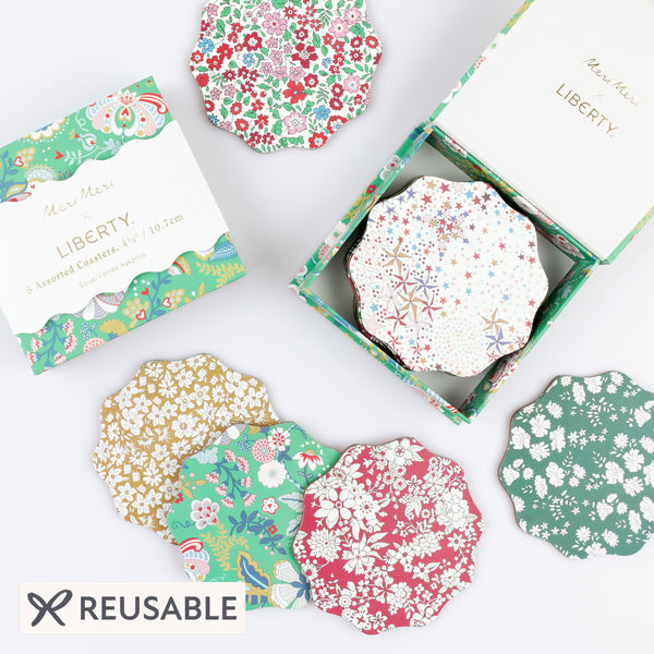 Our Christmas coasters, made from a laminated wood composite, feature elegant Liberty print designs, perfect as a host gift. Image1