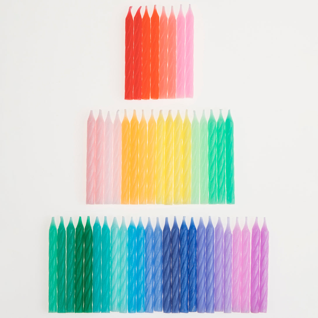 Add a rainbow of colour to your birthday party supplies with a colourful felt garland, paper tablecloth and bright birthday cake candles. 