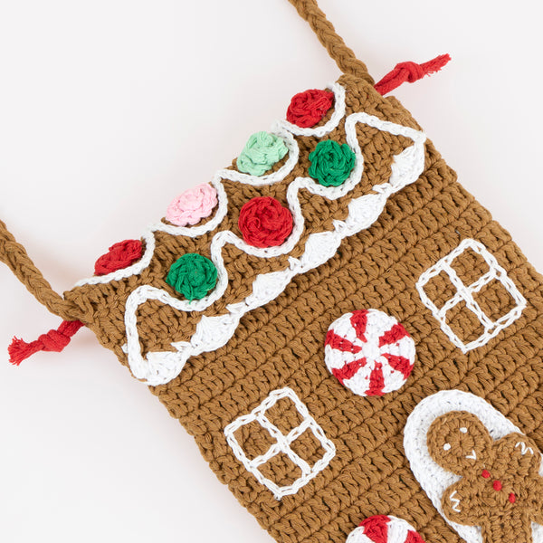 Our Christmas bag, in a shoulder bag style, is made with crochet in a gingerbread house design, a great accessory gift. Image3