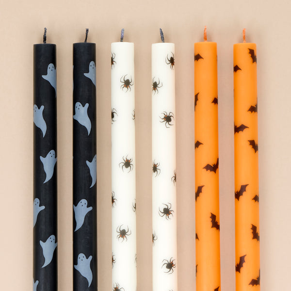 Our tall Halloween candles, in orange, black and white, feature ghosts, bats and spiders, and coloured wicks. Ideal for party decorations. Image3