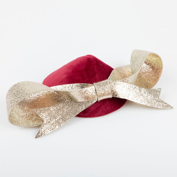 Our Christmas hat and gold faux leather hair clip is the perfect hair accessory for an elegant festive look. Image1