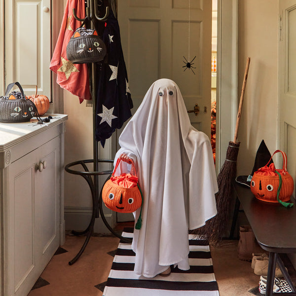 Our Halloween basket has a cute pumpkin face and fun tassels. Image2