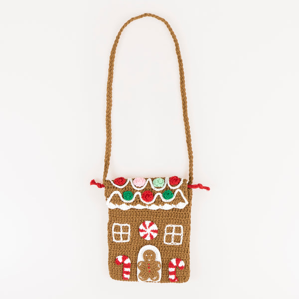 Our Christmas bag, in a shoulder bag style, is made with crochet in a gingerbread house design, a great accessory gift. Image1