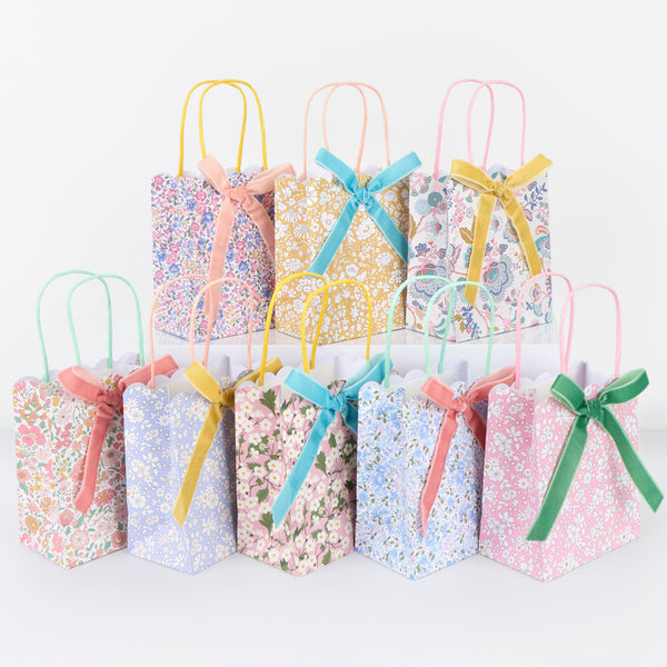 Our party favour bags are designed with floral Liberty print designs, velvet bows and twisted paper handles, ideal to impress party guests. Image1