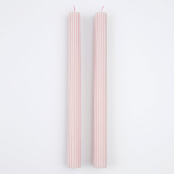 Our tall candles, in a pink colour with ridged details, add a stunning look to any party.