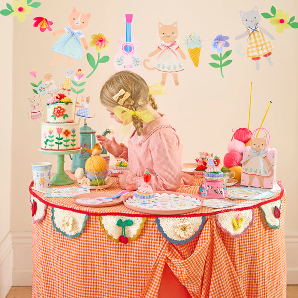 Our crochet garland features scalloped pennants with colourful designs, presented in an organza drawstring bag, a beautiful decoration. Image2