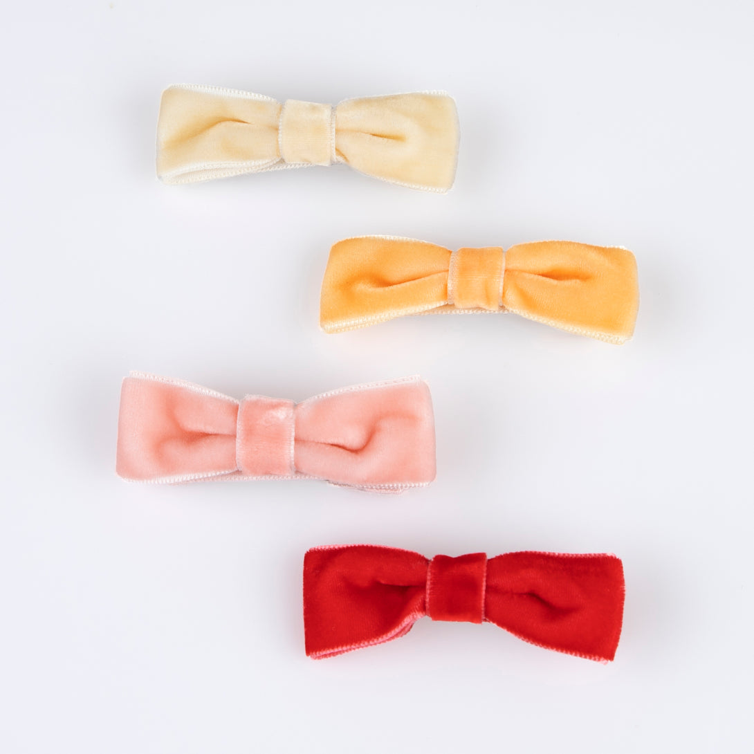 Our hair clips feature different coloured velvet bows, with gold tone clips, for stylish hair accessories.