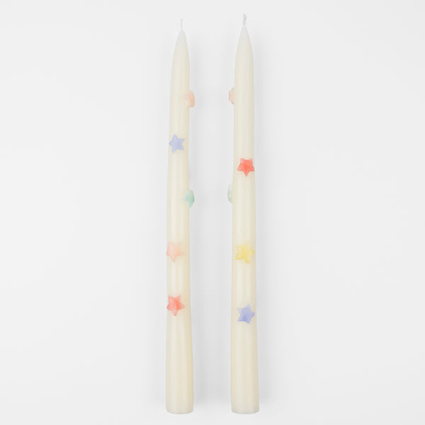 Our taper candles, with coloured stars, will look great as table candles or on placed on the mantel.