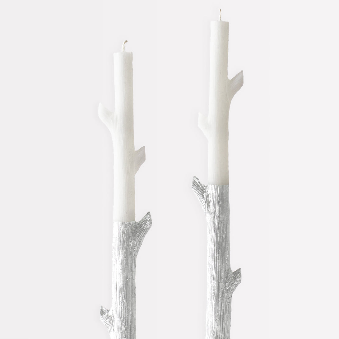 Our tall candles, shaped like sticks and dipped in silver ink, will look amazing as Halloween or Christmas table decorations.