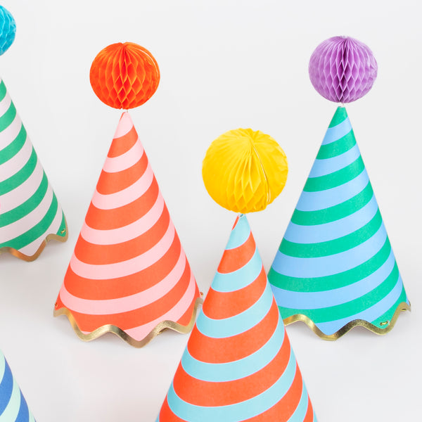 Our party accessories include hats with stripes and pompoms for a fun look. Image4