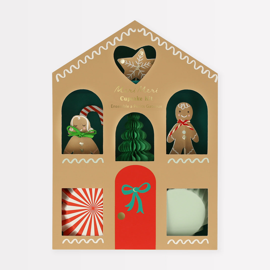 Our special Christmas cupcake kit features festive cupcake toppers and cupcake cases all packaged in a charming paper gingerbread house.