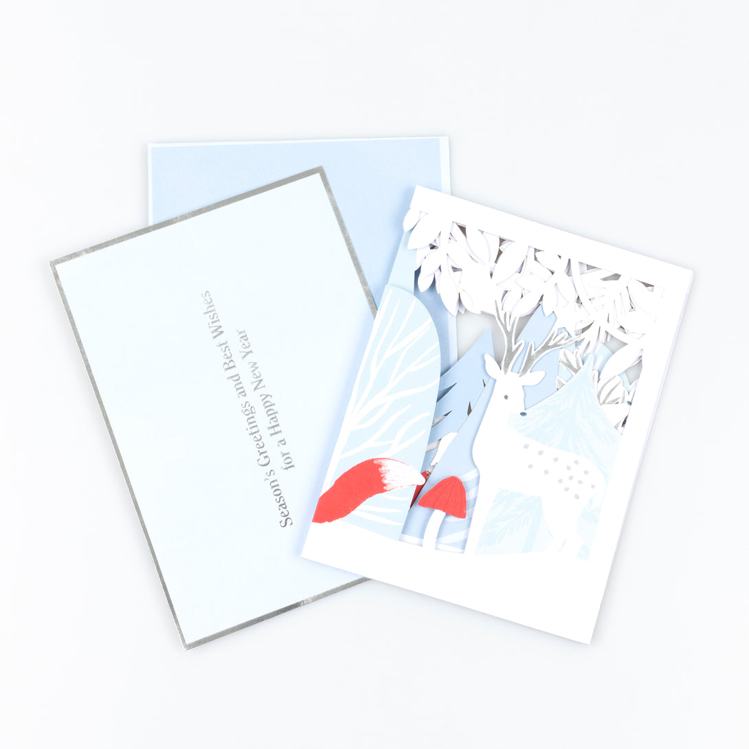 Our concertina card for Christmas opens up to show a winter woodland scene with animals, funghi and foliage, a beautiful decoration. Image3