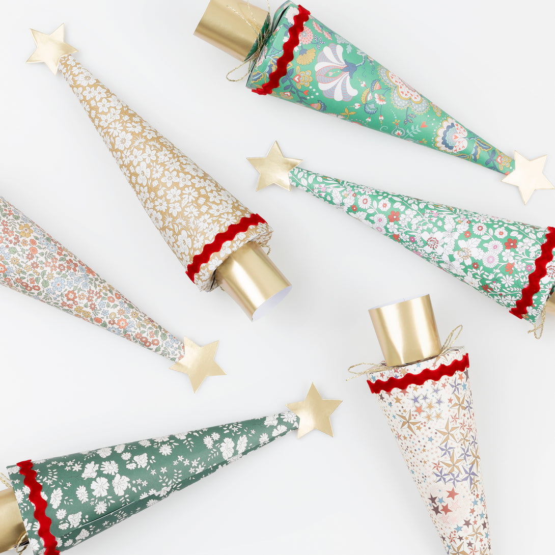 Our Christmas crackers feature stunning Liberty floral prints, velvet ric rac, matt gold tone details, and contain a party hat, joke and quality gift. Image5