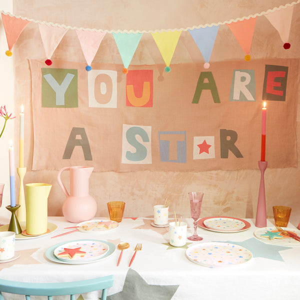 Add a pop of pastel colour to your party table or wall with our flag garland with pompoms. Image3