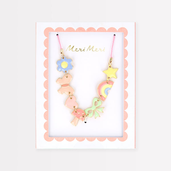 Our charms necklace is crafted with colourful enamel charms with a pink cord and gold tone lobster clasp, a pretty necklace for kids.