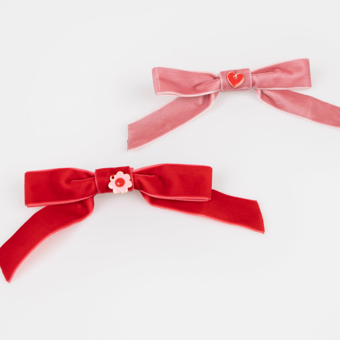 Our Valentine's hair accessories, made with soft velvet bows and enamel charms, make great Valentine's day gifts.