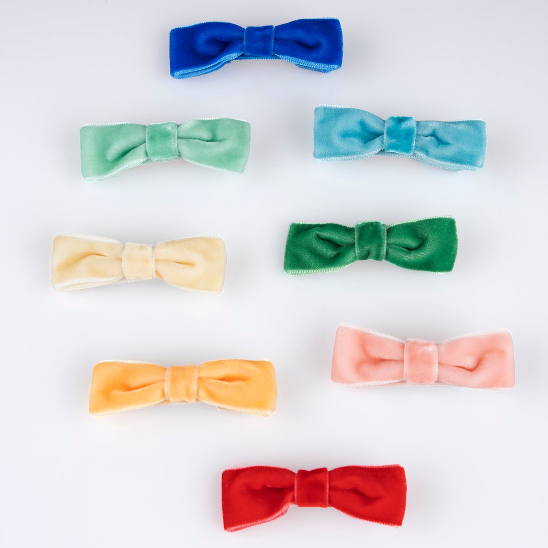 Our hair clips feature different coloured velvet bows, with gold tone clips, for stylish hair accessories.