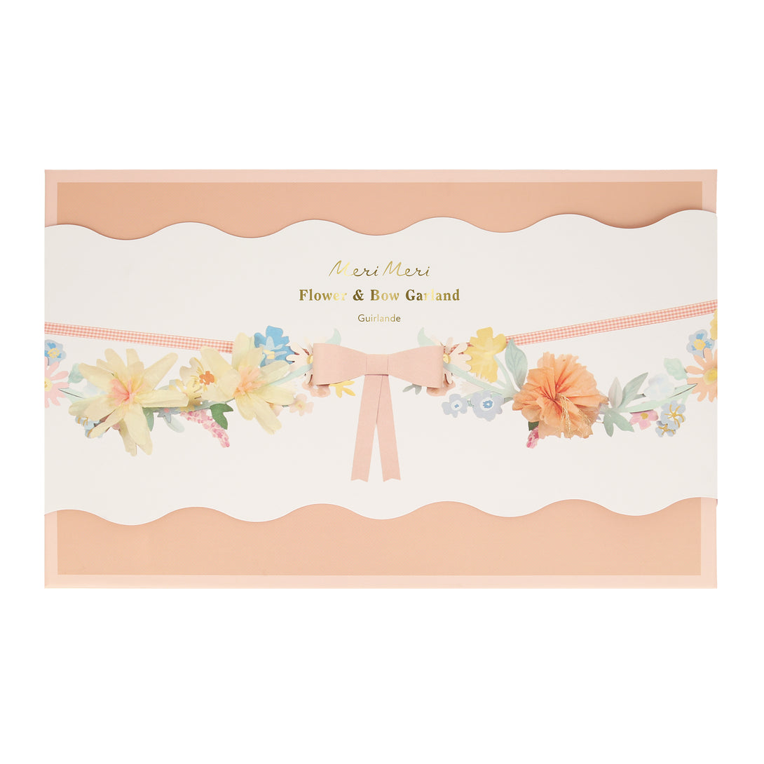 Our paper garland, featuring flowers and bows, is the perfect baby shower garland or Easter garland.