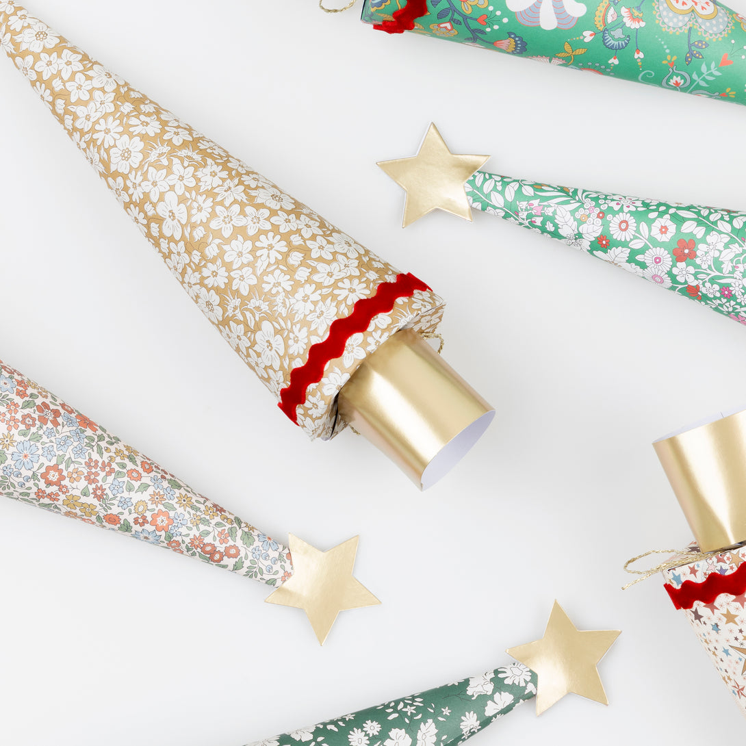 Our Christmas crackers feature stunning Liberty floral prints, velvet ric rac, matt gold tone details, and contain a party hat, joke and quality gift. Image4