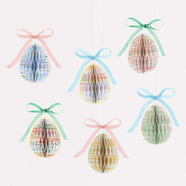 Our Easter egg decorations are made from honeycomb paper with Liberty floral designs, scalloped edges and velvet bows for luxe look. Image1