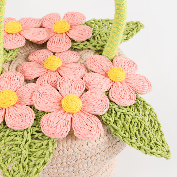 Our woven paper pink basket bag features paper flowers and leaves, a cord handle and a calico lining. Image4