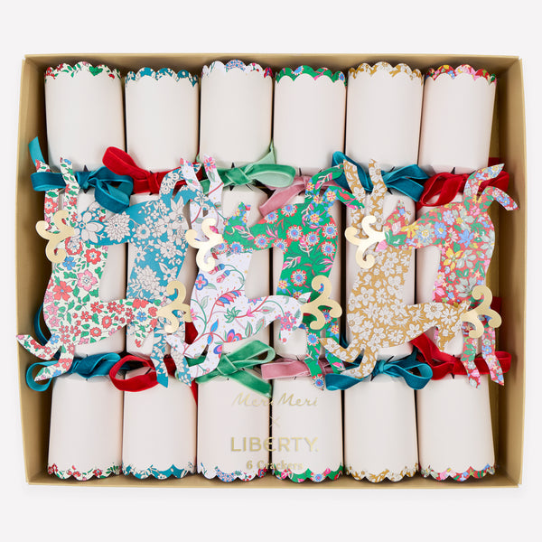 Make your Christmas dinner table look elegant with our luxury reindeer crackers with Liberty prints, velvet bows and a wonderful decorative gift. Image1