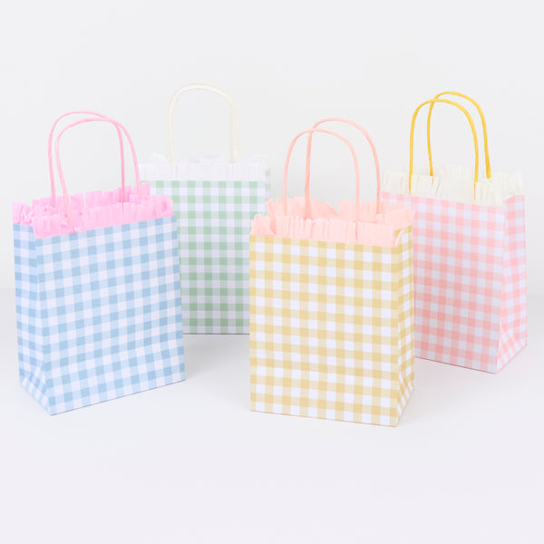 Our party favour bags feature four pretty gingham print designs, crepe paper fringing and twisted rope handles, for sturdy and decorative use. Image2