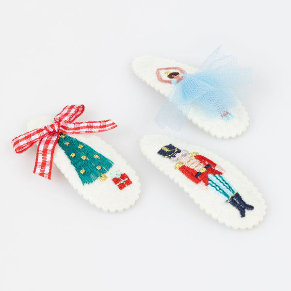 Our felt Christmas hair clips feature iconic Nutcracker characters, embroidered with embellishments, for a stylish look. Image2