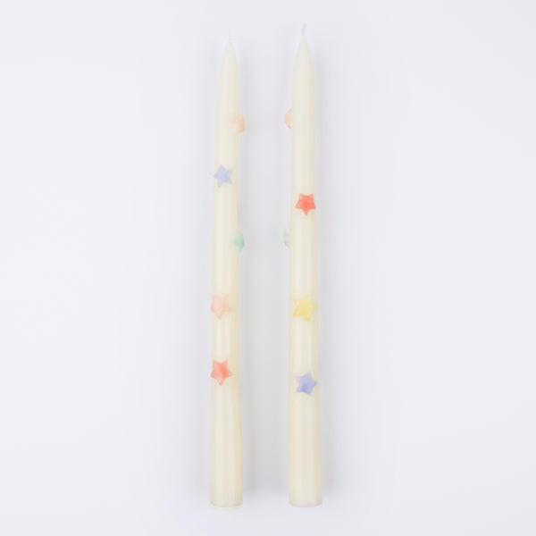 Our taper candles, with coloured stars, will look great as table candles or on placed on the mantel.