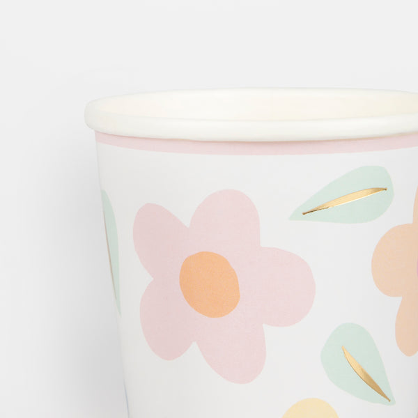 Our party cups have 90s inspired floral designs and shiny gold foil details. Image3