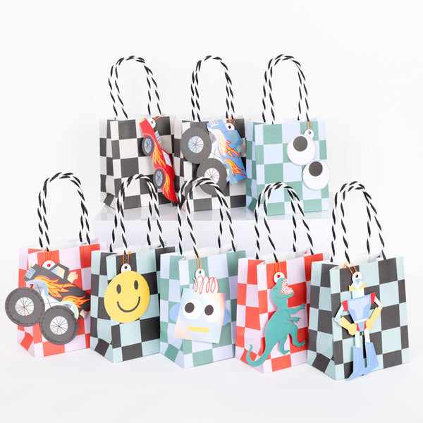 Our party bags feature a cool checked design and retro toy stickers, perfect for a monster truck party, robot party or any birthday theme.