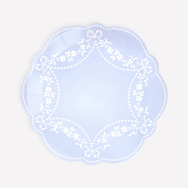 Our paper plates, made in a cornflower blue shade with white ornate patterns, are ideal as baby shower plates or for any special meal. Image1