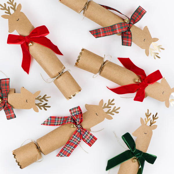 Our Christmas crackers feature reindeer with gold foil antlers and bow details in tartan and velvet, with a joke, party hat and small gift inside. Image4