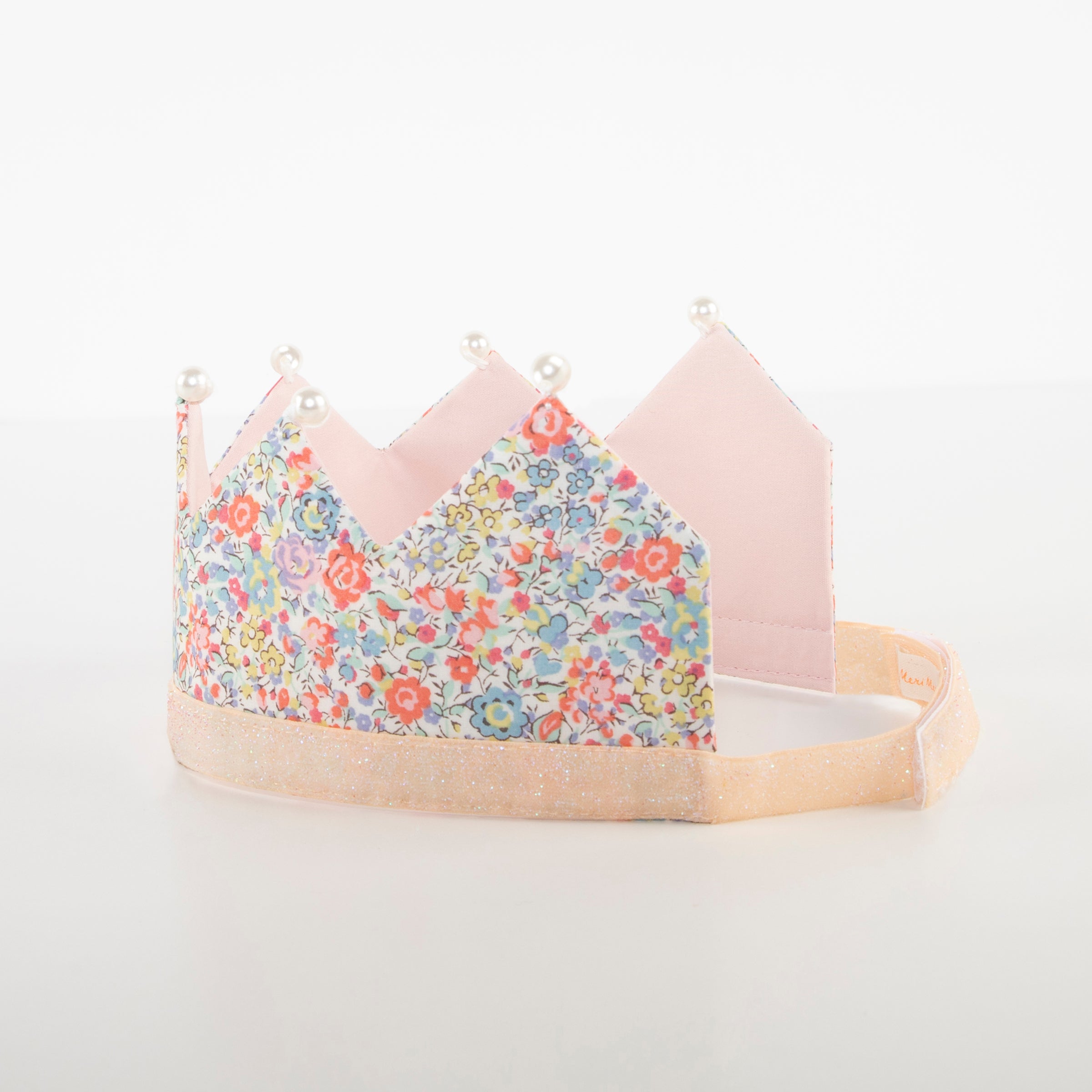 Our beautiful princess crown made with Liberty floral fabric is beautifully embellished with fake pearls.