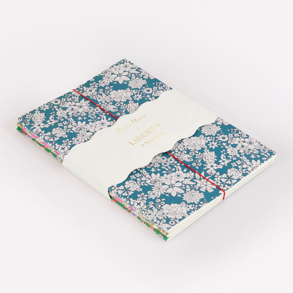 Our soft Christmas notebook set of three have pretty floral Liberty print design covers in tones of green, and lined pages, ideal for gifting. Image1