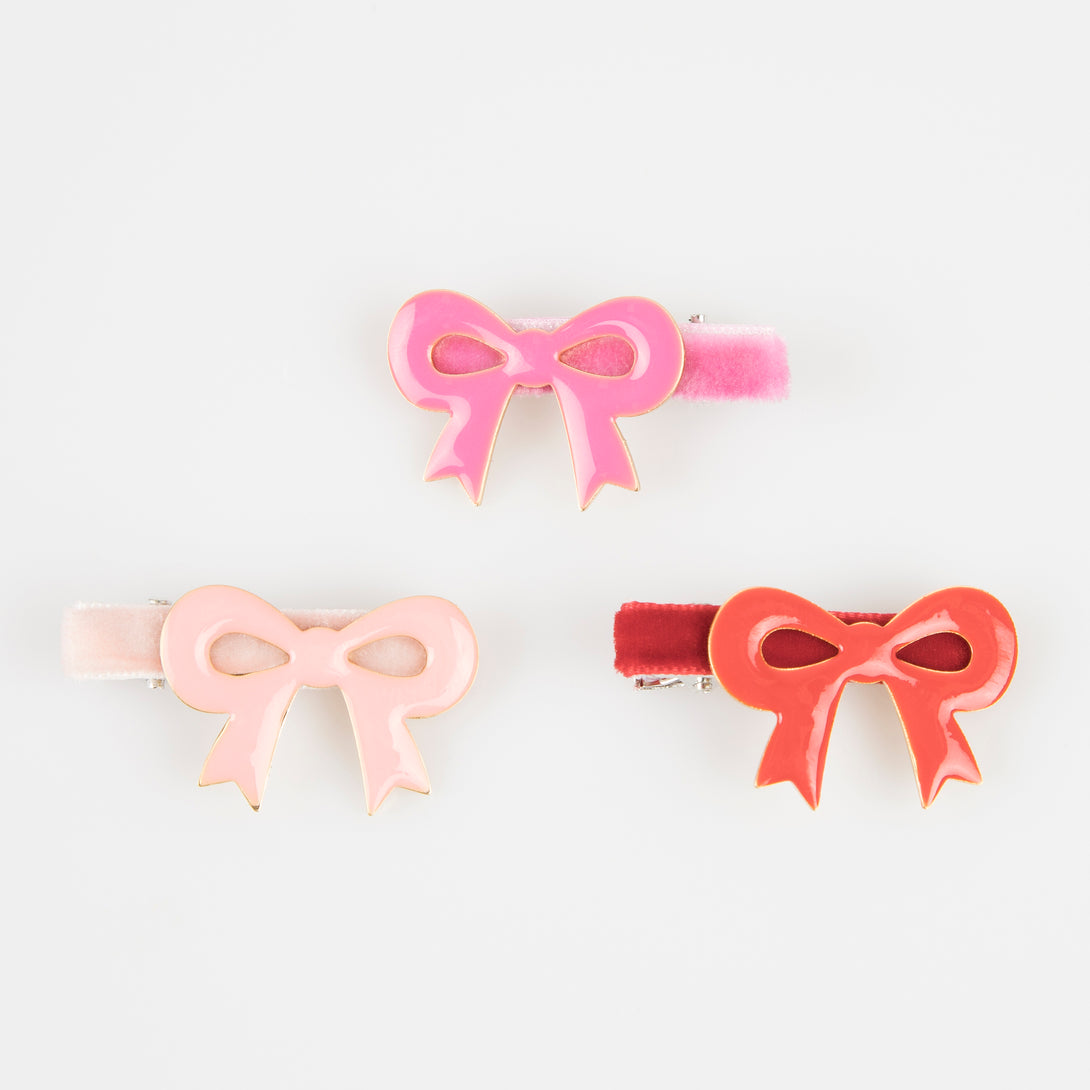 Our luxury red and pink hair clips feature enamel bows and velvet ribbons - the perfect Valentine's hair accessories for kids.