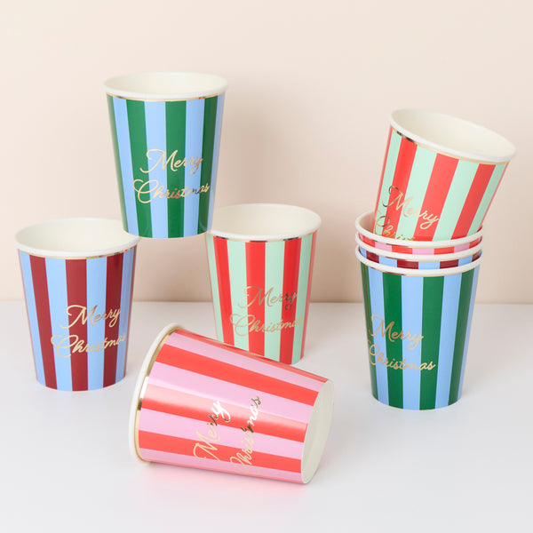 Our Christmas cups, paper cups with vibrant stripes, a Merry Christmas message and lots of gold foil, are perfect for hot and cold drinks. Image1