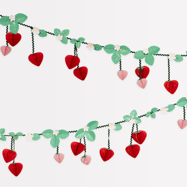 Our strawberry party set includes summery party supplies with strawberry designs, including plates, cups, napkins and a garland.  Image2