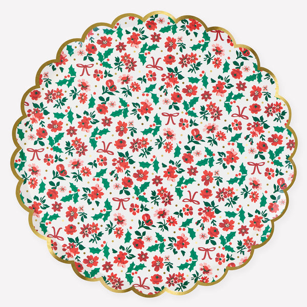 Our Christmas dinner plates, made from paper, feature a beautiful floral ditsy design, with holly and bows, and a scalloped border for style. Image1