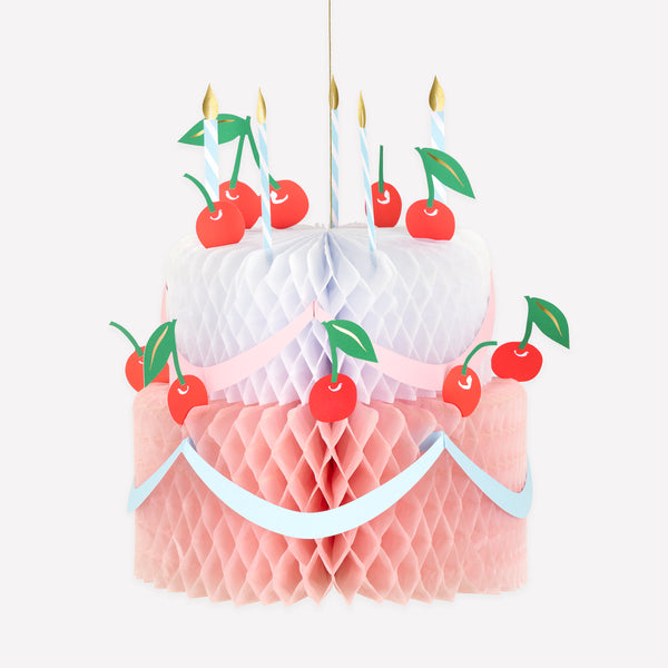 Our birthday cake decoration is a beautiful hanging decoration in the shape of a birthday cake, with honeycomb paper and paper candles. Image1