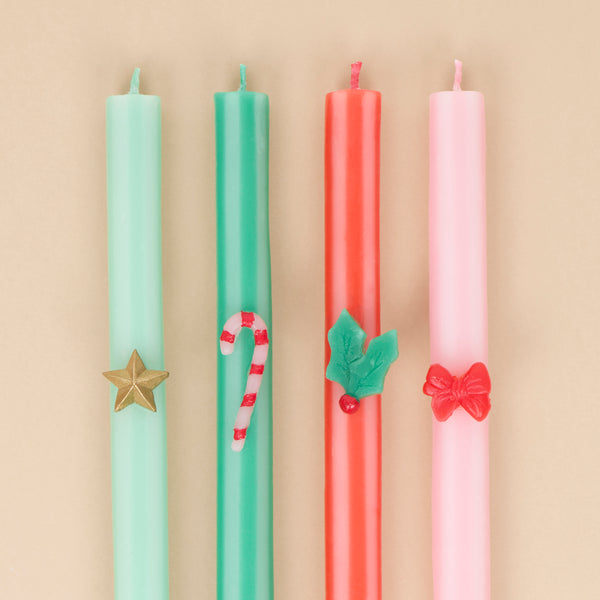Our tall Christmas candles feature 4 different seasonal stripes teamed with wax festive icons and coloured wicks for a stylish look. Image2